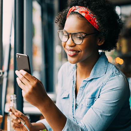 woman looking at mobile phone