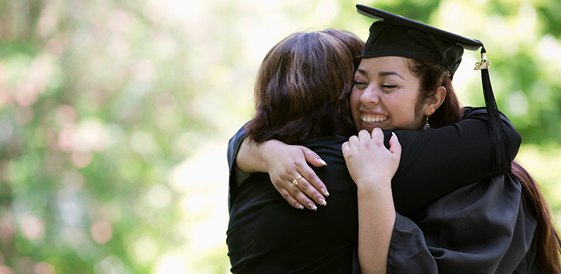 Graduate hugging her mother