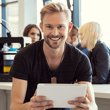 man using tablet smiling